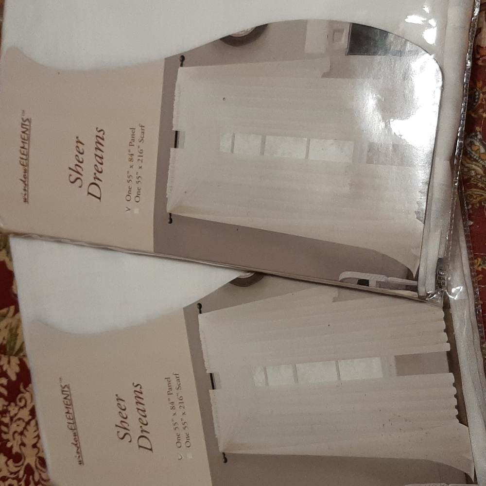 Window sheers by window elements. One panel set of two.